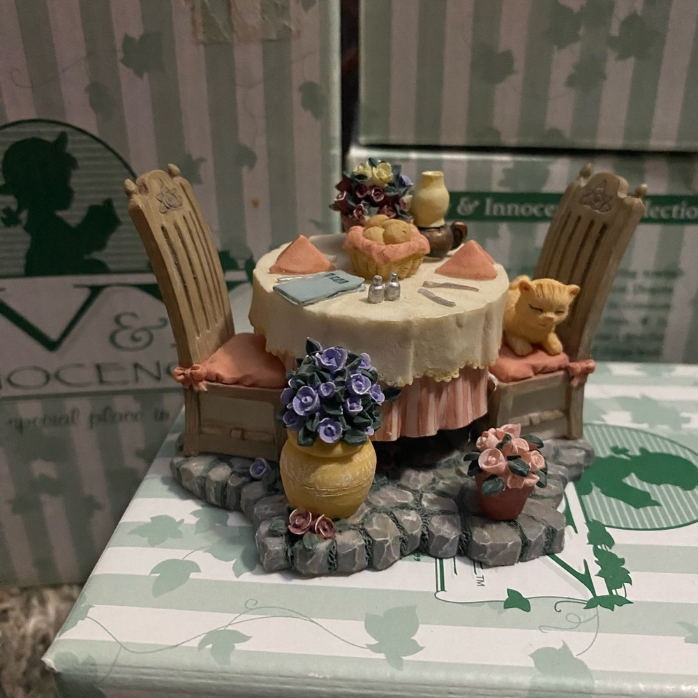 Yea party figurine, featuring a cat on a chair.  (A10)
